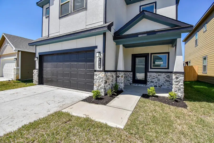 Front exterior of a new home in Glendale Lakes, Arcola, TX, highlighting curb appeal (Image 1).