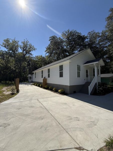 Front exterior of a new home in , Johns Island, SC, highlighting curb appeal (Image 24).
