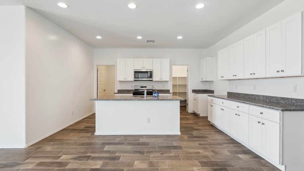 Representative furnished interior of a home built from the Puffin by D.R. Horton in Moonlight, Maricopa (Image 6).