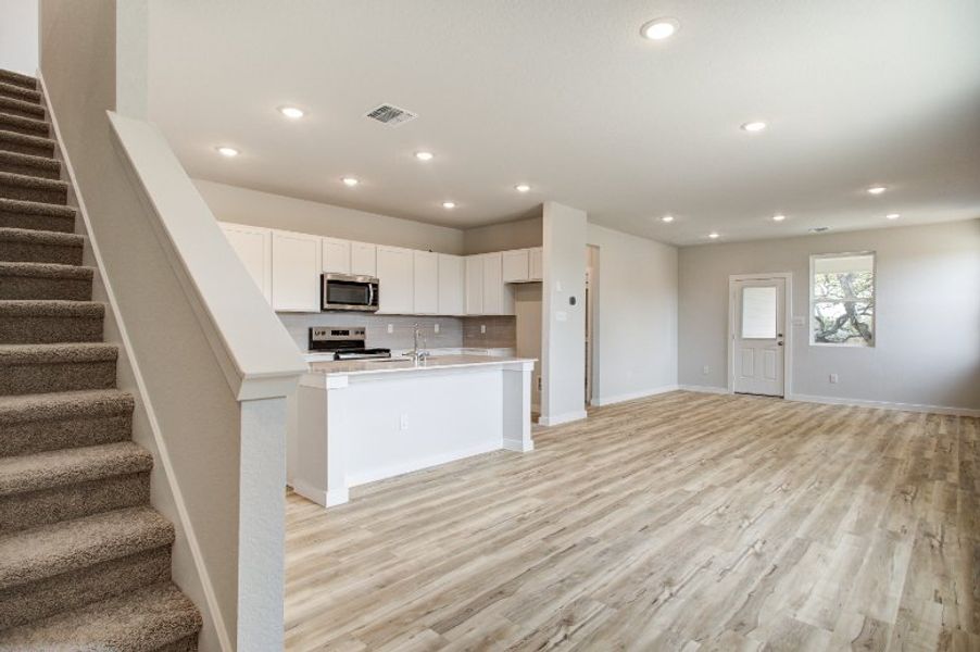 A kitchen with white cabinets. A kitchen with white cabinets.
