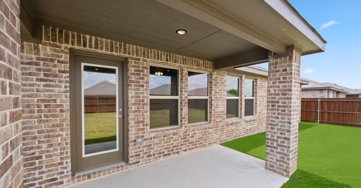 Representative exterior photo of a completed home built from the Lincoln by Impression Homes in Baker Farms, Cleburne, TX (Image 26).
