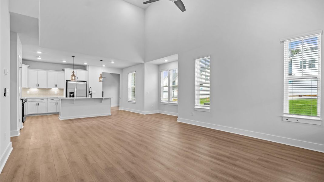 Spacious family room with rich hardwood flooring and elegant trim work in a reputable DRB Homes build in Anderson, SC
