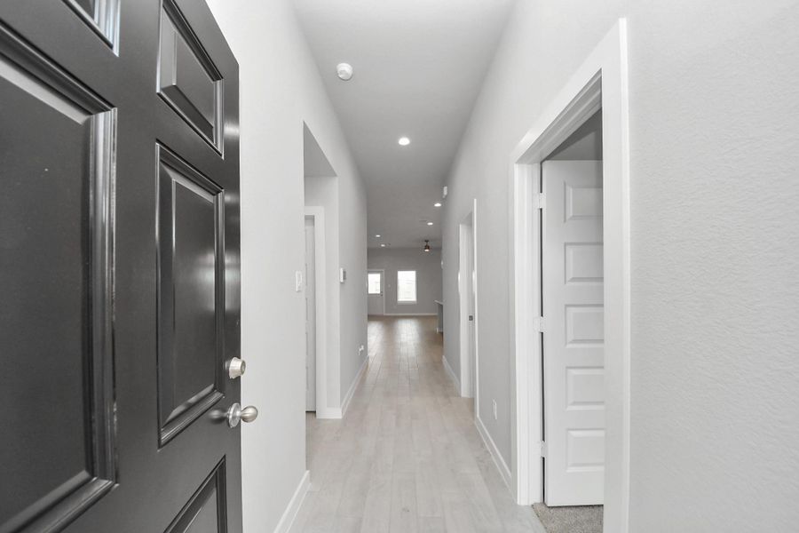 As you step into the threshold of this luxurious home, you'll soon be welcomed by an elegant glass door (to be installed). Inside, soaring ceilings amplify the spaciousness, while the refined wood-look tile flooring and oversized baseboards exude sophistication and charm.