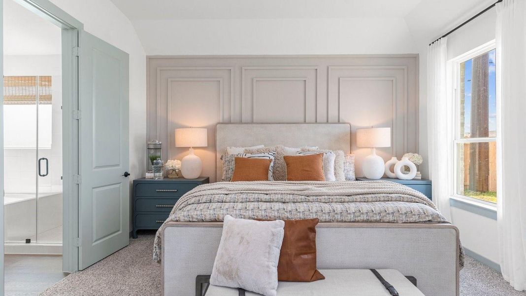 Primary bedroom with ceiling fan, plush carpeting, and a large walk-in closet. Primary bedroom with ceiling fan, plush carpeting, and a large walk-in closet.