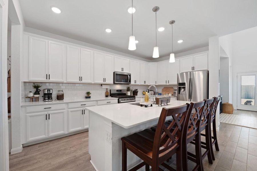 Kitchen has a spacious island with room for bar stools. Kitchen has a spacious island with room for bar stools.
