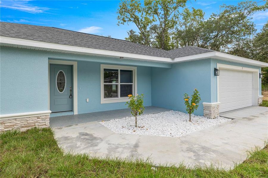Front exterior of a new home in , Ocklawaha, FL, highlighting curb appeal (Image 17). Front exterior of a new home in , Ocklawaha, FL, highlighting curb appeal (Image 17).