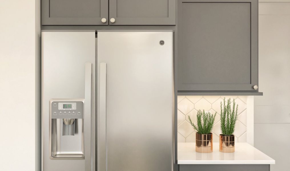 Hexagonal backsplash and stainless steel appliances