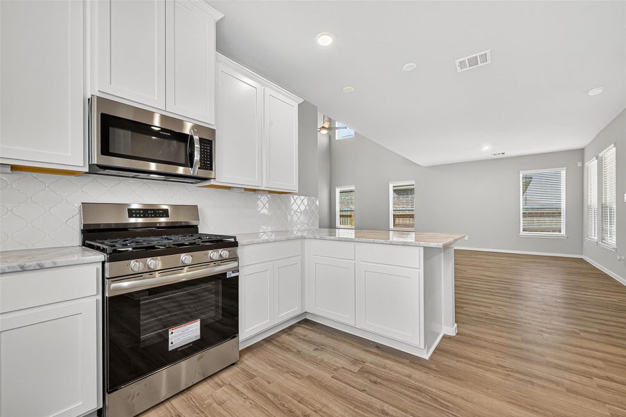 Furnished interior view inside a new home in Sunterra, Katy (Image 9).