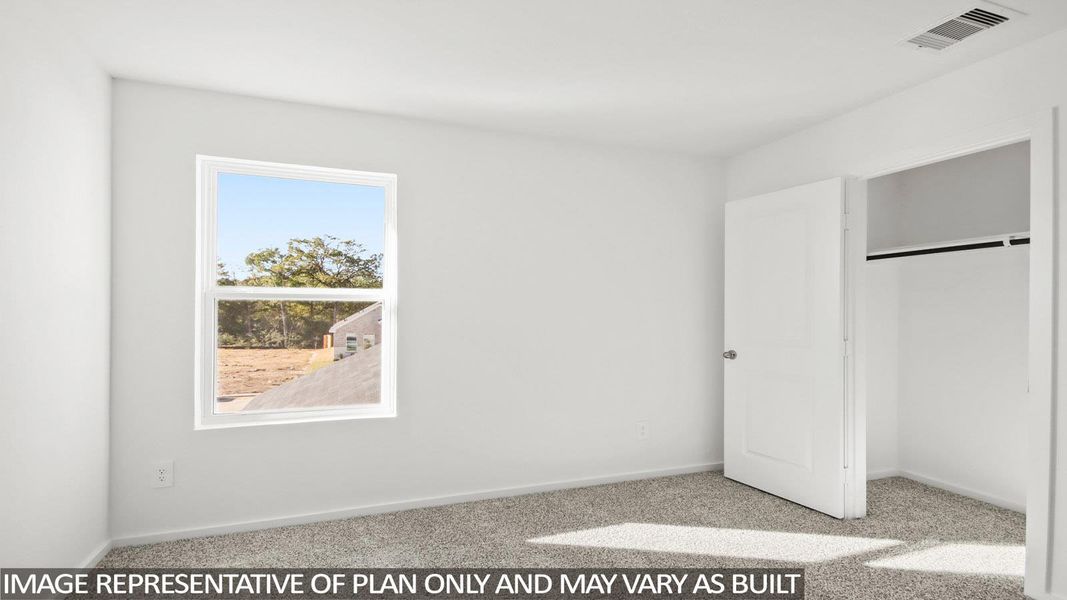 Unfurnished bedroom featuring light carpet and a closet Unfurnished bedroom featuring light carpet and a closet