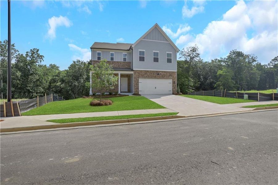 Front exterior of a new home in Easton Walk, Lawrenceville, GA, highlighting curb appeal (Image 17). Front exterior of a new home in Easton Walk, Lawrenceville, GA, highlighting curb appeal (Image 17).