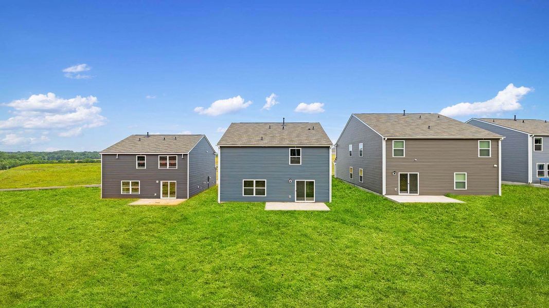 Front exterior of a new home in Paddock Point, Roebuck, SC, highlighting curb appeal (Image 21).
