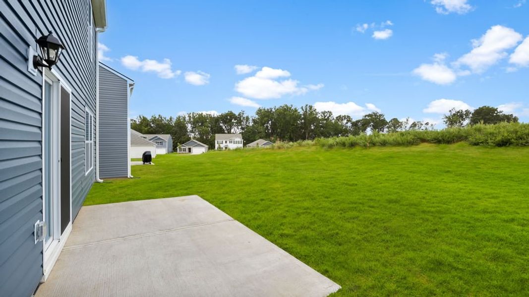Exterior details and patio area of a home in Treemont Commons, Wellford (Image 29).