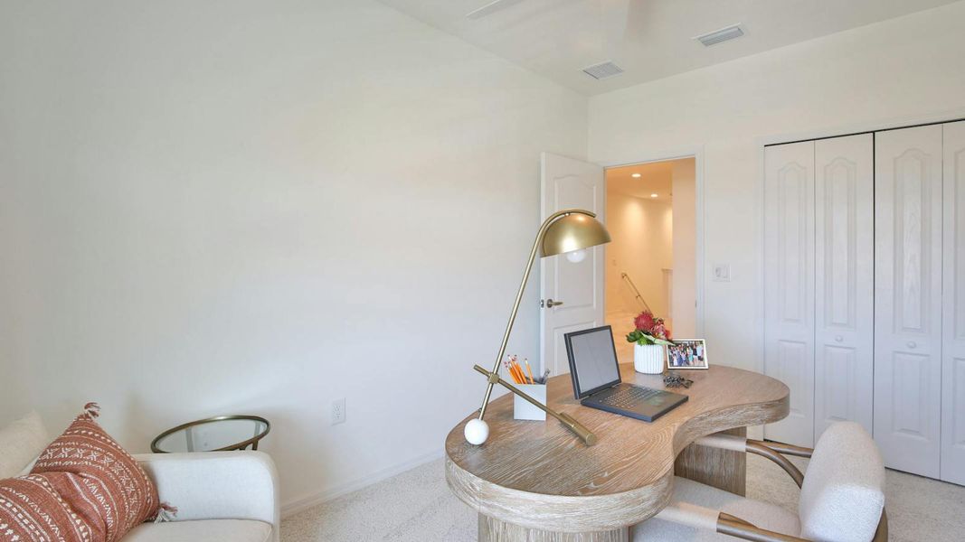 Furnished interior view inside a new home in Palm Grove Real Estate and Homes for Sale in Lakewood Ranch, FL - Neal Communities, Lakewood Ranch (Image 10).