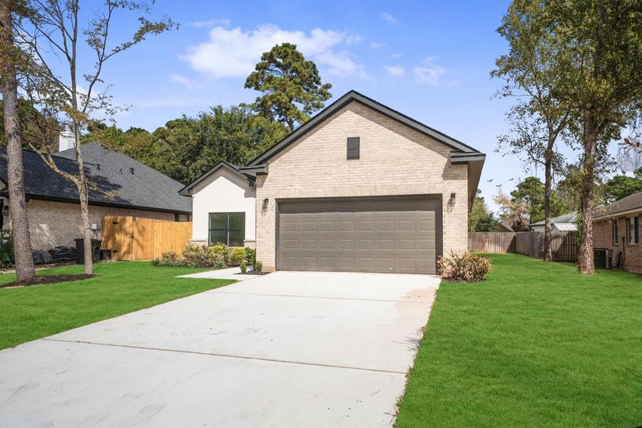 Front exterior of a new home in , Montgomery, TX, highlighting curb appeal (Image 26).