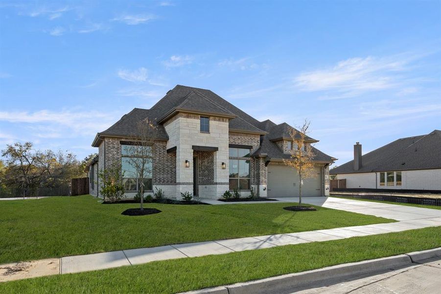 Front exterior of a new home in Mockingbird Hills, Joshua, TX, highlighting curb appeal (Image 21). Front exterior of a new home in Mockingbird Hills, Joshua, TX, highlighting curb appeal (Image 21).