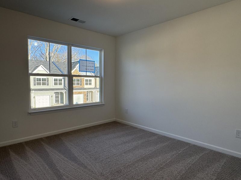 Spacious, unfurnished interior of a new home in East Main Townes, Spartanburg (Image 13).