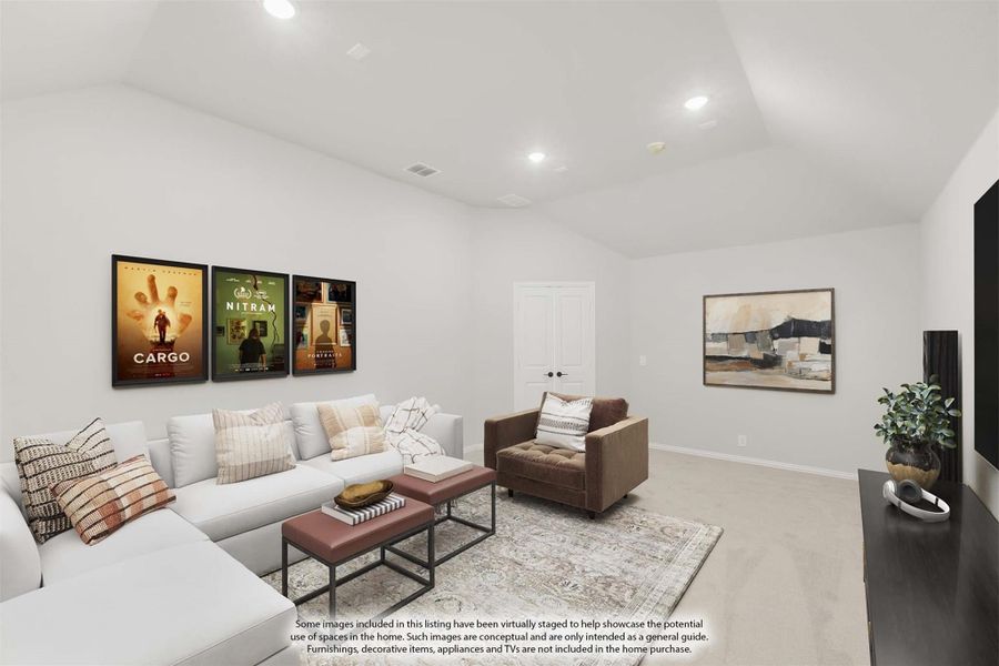Bonus room with white sectional sofa, brown armchair, carpet flooring, and framed movie posters on the wall Bonus room with white sectional sofa, brown armchair, carpet flooring, and framed movie posters on the wall