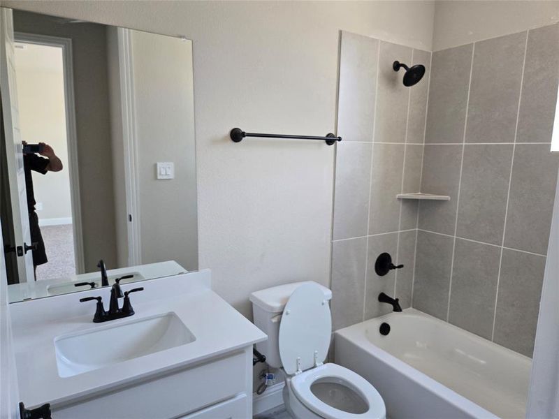 Bathroom with bathtub / shower combination and vanity