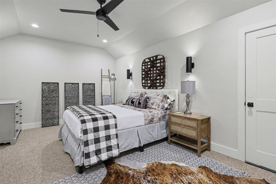 Bonus/Media/5th bedroom upstairs with vaulted ceiling, ceiling fan, recessed lighting, and carpet flooring