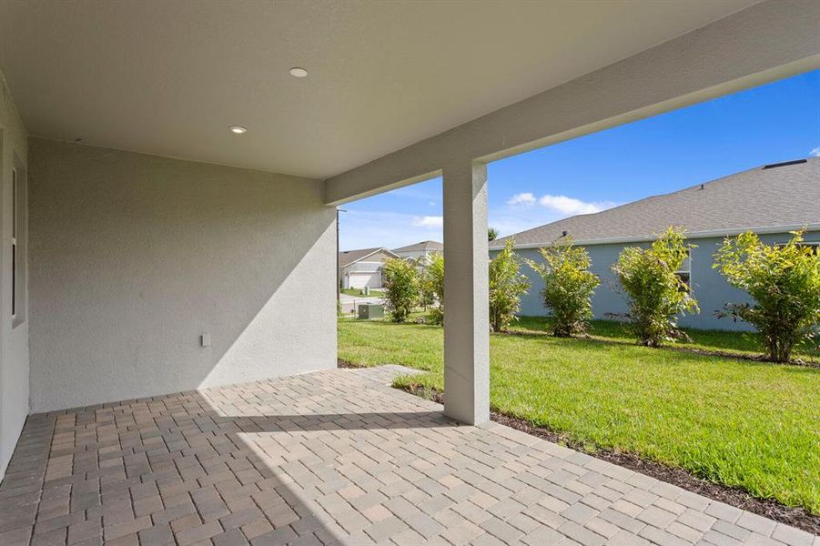 Exterior details and patio area of a home in Windwater, Parrish (Image 3).