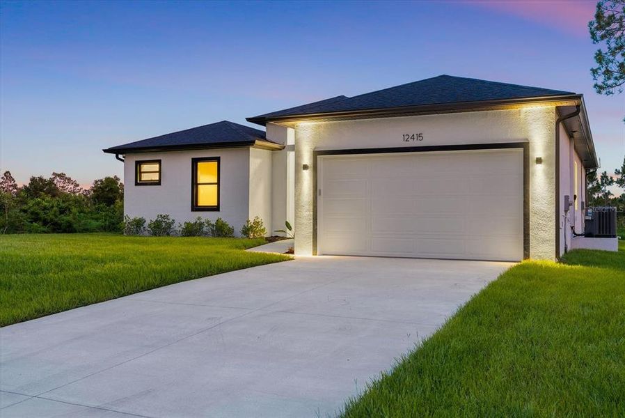 Front exterior of a new home in , Port Charlotte, FL, highlighting curb appeal (Image 23). Front exterior of a new home in , Port Charlotte, FL, highlighting curb appeal (Image 23).