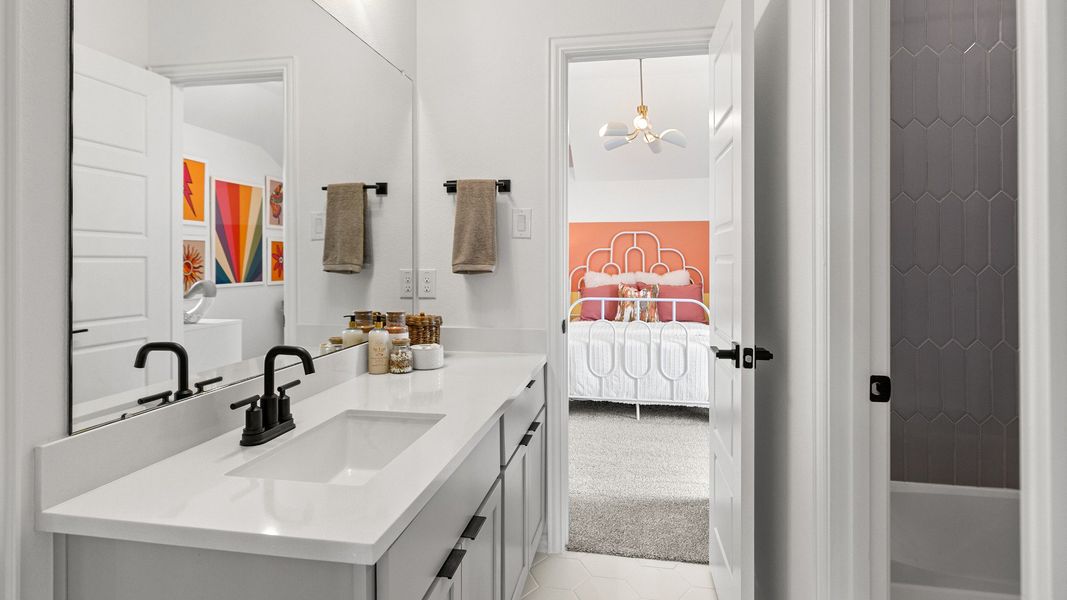 Representative furnished interior of a home built from the Magnolia by Brightland Homes in Sunterra, Katy (Image 18).