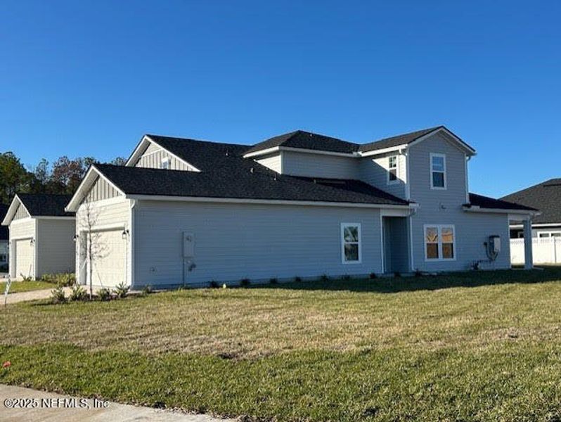 Front exterior of a new home in , St. Augustine, FL, highlighting curb appeal (Image 18).