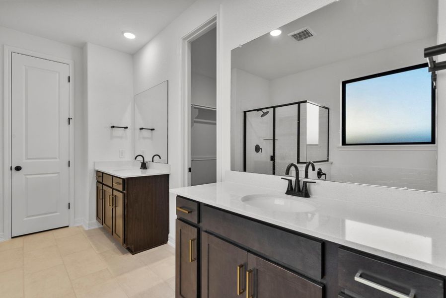 Primary Bathroom with separate sinks and walk-in shower