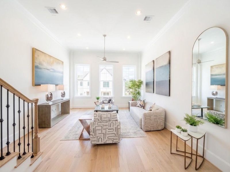 soaring 12 ft ceilings let in tons of natural light for an airy, spacious and modern living room space