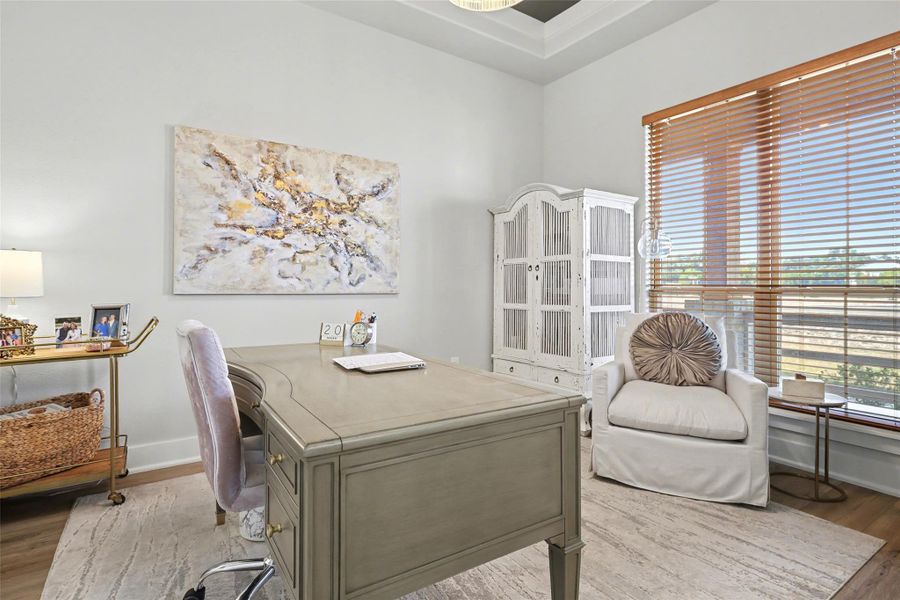 Dedicated study with shaker style French doors with LVP floors and 6" baseboards