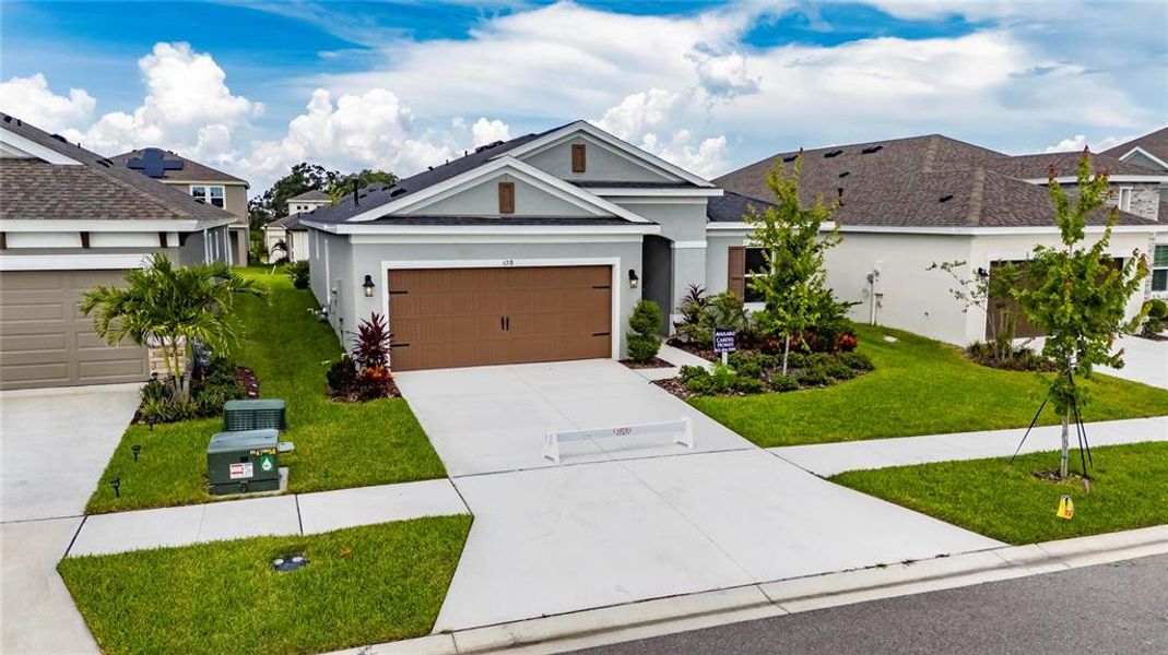 Front exterior of a new home in Waterset, Apollo Beach, FL, highlighting curb appeal (Image 23).