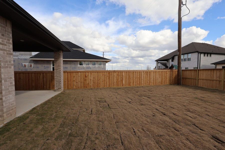 Exterior details and patio area of a home in Dunham Pointe, Cypress (Image 25).