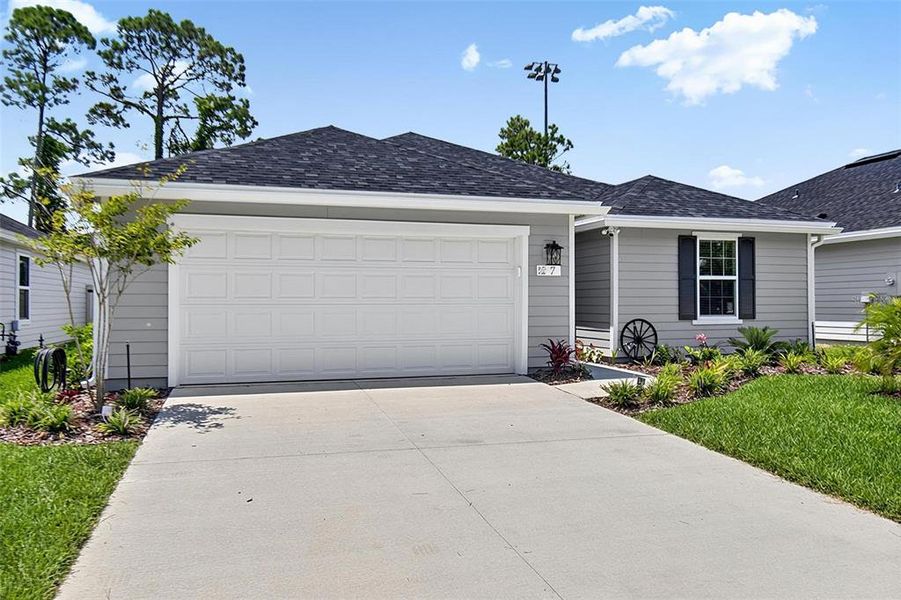 Front exterior of a new home in , Flagler Beach, FL, highlighting curb appeal (Image 1). Front exterior of a new home in , Flagler Beach, FL, highlighting curb appeal (Image 1).