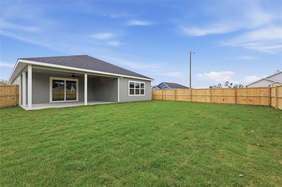 Exterior details and patio area of a home in Grand Oaks, Gainesville (Image 3).