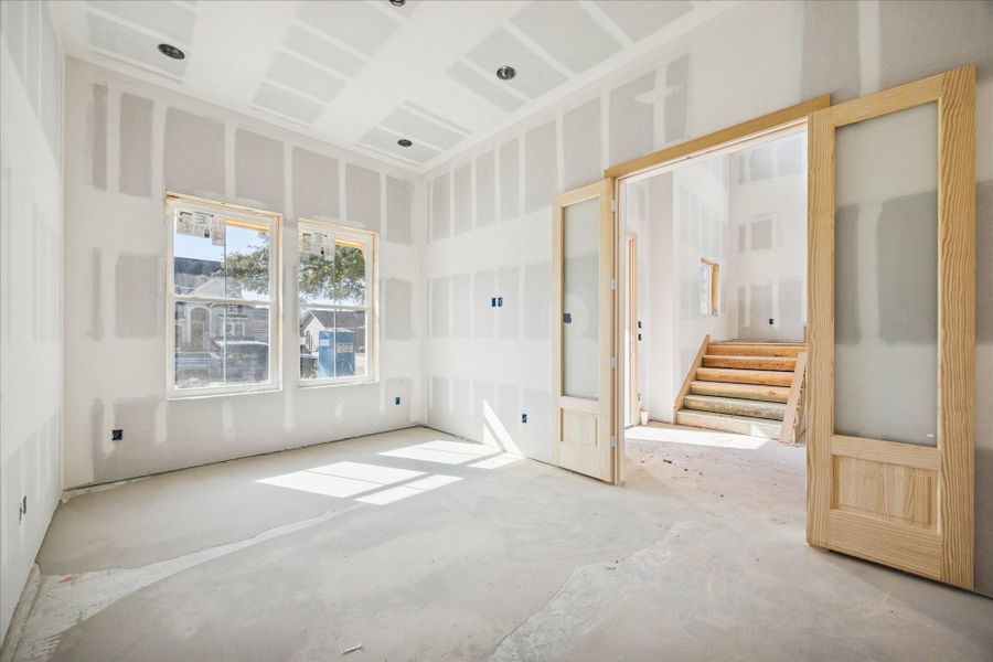 Positioned off the main entry, the study provides a calm, enclosed space ideal for a home office or library. Generous windows bring in soft natural light, while the layout allows for built ins, desk space, and comfortable seating without interrupting the flow of the surrounding living areas. Positioned off the main entry, the study provides a calm, enclosed space ideal for a home office or library. Generous windows bring in soft natural light, while the layout allows for built ins, desk space, and comfortable seating without interrupting the flow of the surrounding living areas.