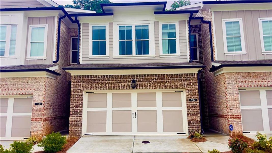 Front exterior of a new home in , Cumming, GA, highlighting curb appeal (Image 1). Front exterior of a new home in , Cumming, GA, highlighting curb appeal (Image 1).