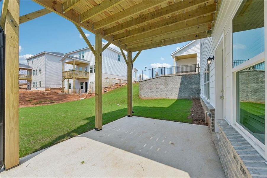 Exterior details and patio area of a home in Martin Springs - Estate Series, Lawrenceville (Image 31).