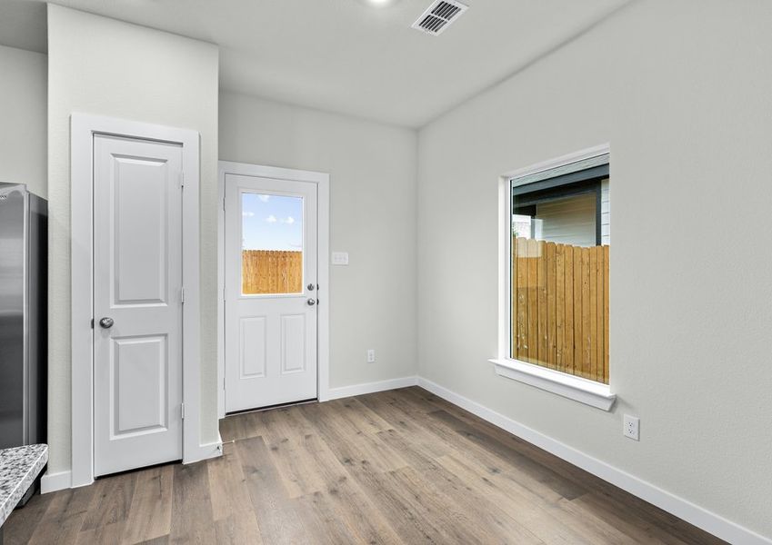 The dining room has a large window that lets in natural light. The dining room has a large window that lets in natural light.
