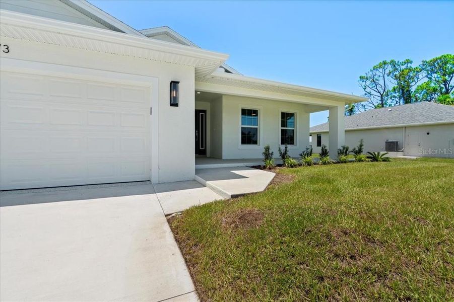 Front exterior of a new home in , Englewood, FL, highlighting curb appeal (Image 19).