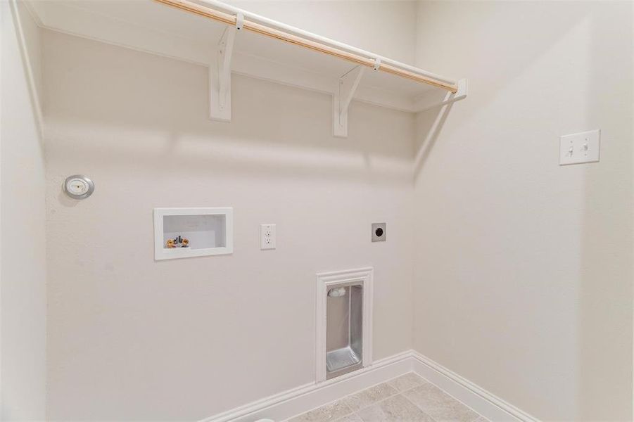 Laundry room featuring washer hookup and hookup for an electric dryer