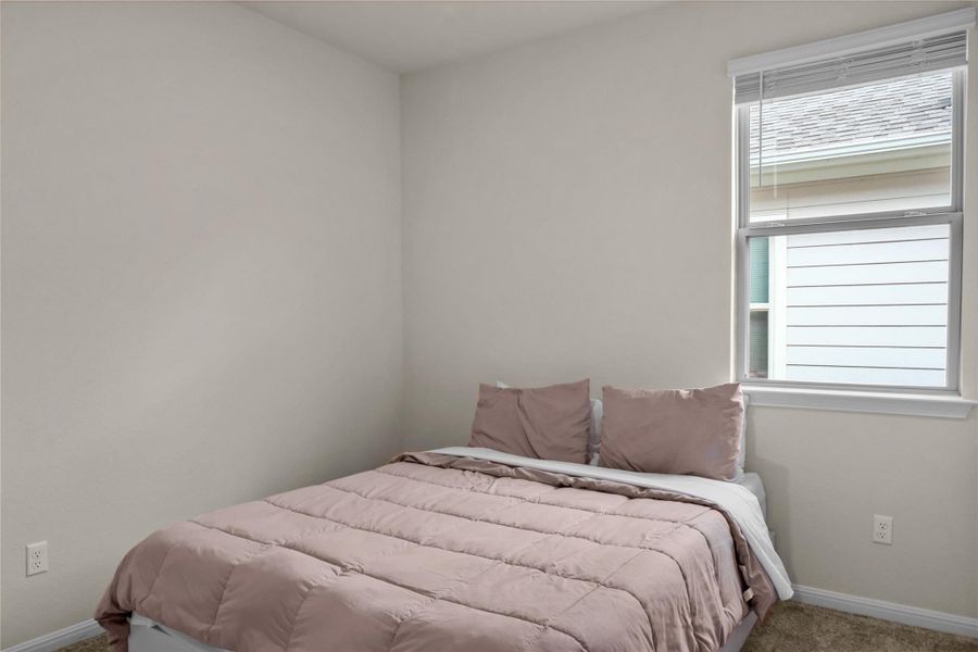 2nd Bedroom featuring baseboards and carpet floors