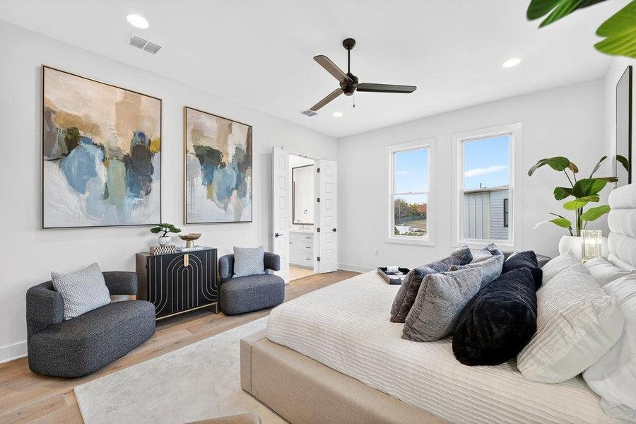 Bedroom featuring wood finished floors, ensuite bath, ceiling fan, and recessed lighting
