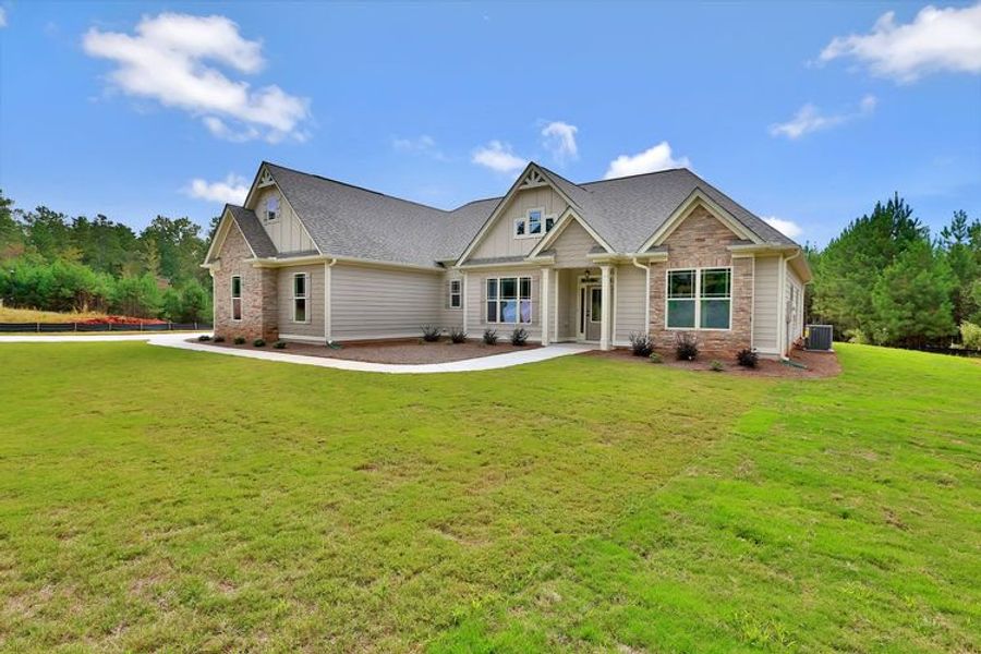 Representative exterior photo of a completed home built from the Candler by Dustin Shaw Homes in Platinum Ridge, Sharpsburg, GA (Image 47). Representative exterior photo of a completed home built from the Candler by Dustin Shaw Homes in Platinum Ridge, Sharpsburg, GA (Image 47).
