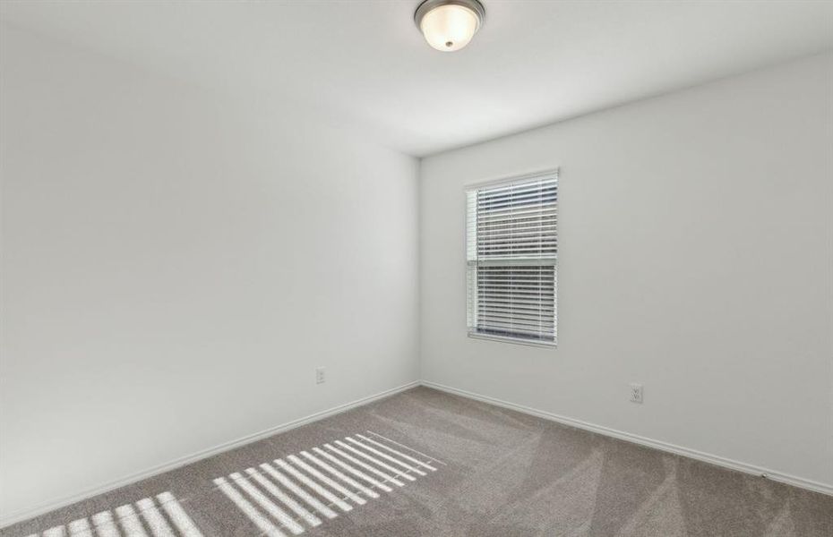 Spacious secondary bedroom with ample closet space *real home pictured