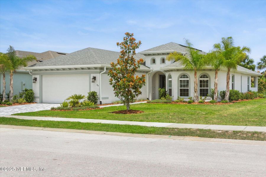 Front exterior of a new home in , Palm Coast, FL, highlighting curb appeal (Image 27). Front exterior of a new home in , Palm Coast, FL, highlighting curb appeal (Image 27).
