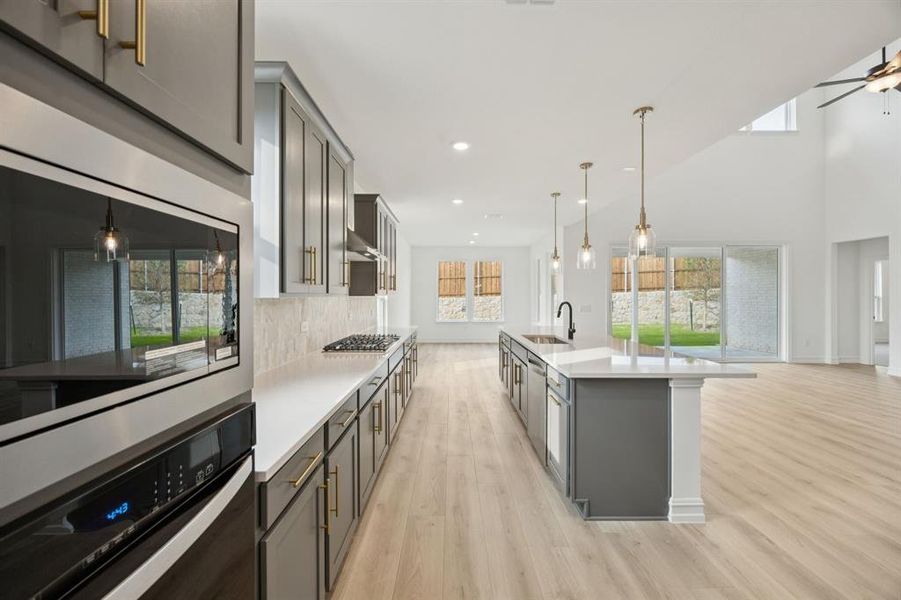 Large island overlooking gathering room and dining areas. *Model representation.