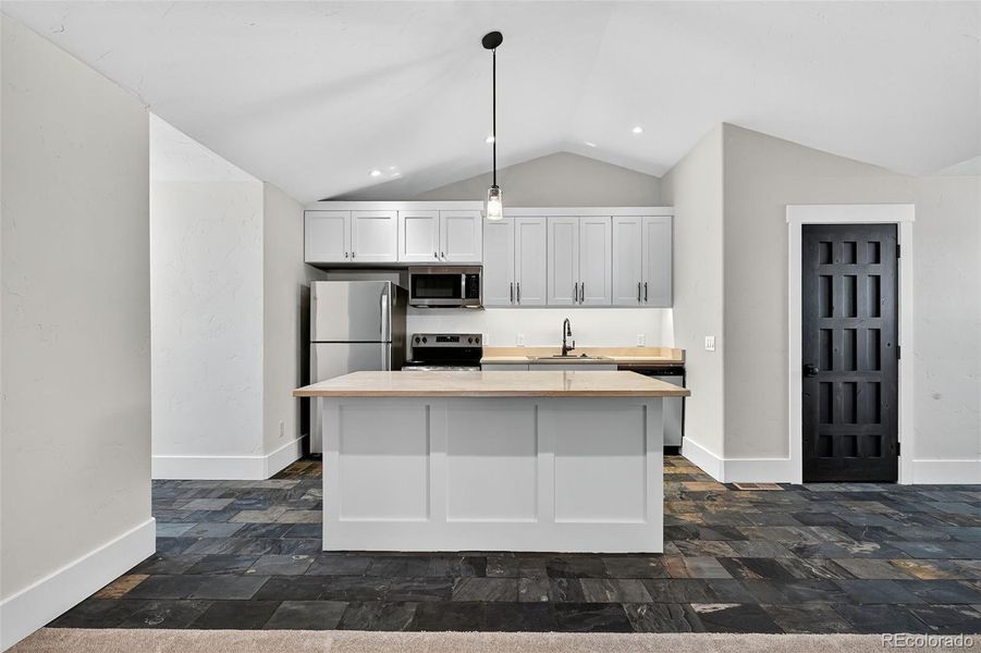 Apt. Kitchen from top of staircase.