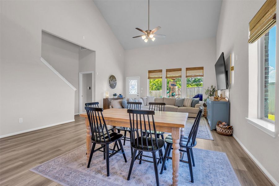 The dining area is conveniently positioned between the kitchen and living room, creating a natural flow between the main gathering spaces.