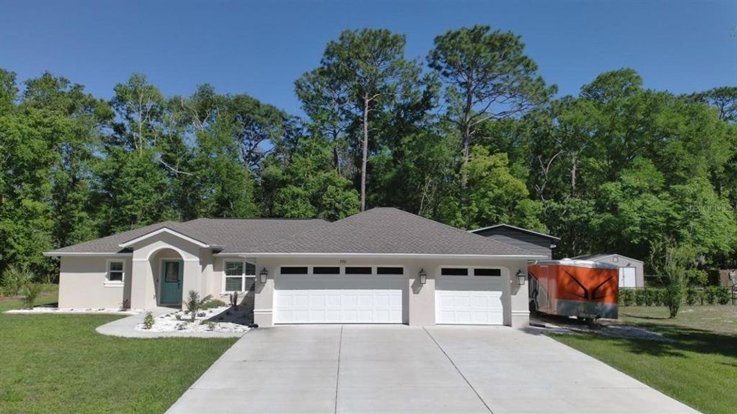 Front exterior of a new home in , Brooksville, FL, highlighting curb appeal (Image 21).