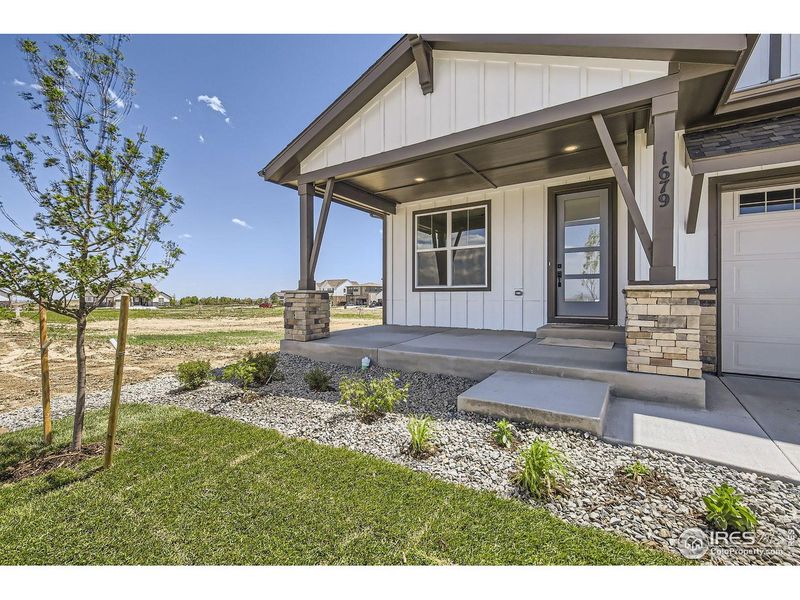 Exterior details and patio area of a home in RainDance, Windsor (Image 3).